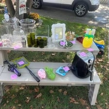 Secondhand household items displayed at a yard sale