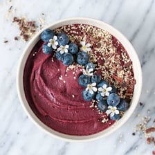 Dark purple açaí berries in a bowl