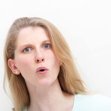 A person displaying a mild expression of surprise