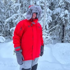 A warm coat worn outdoors in cold weather