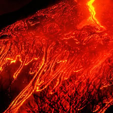 Molten red lava flowing from a volcano