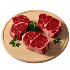 An uncooked steak displayed on a cutting board
