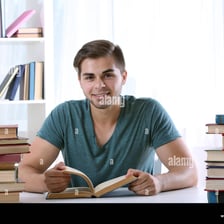 A person placing a book on a table