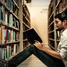 Students reading books for a literature class