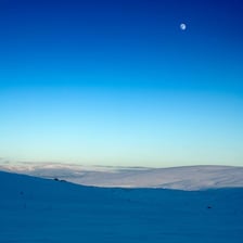 A clear blue sky over a landscape
