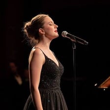 A choir singer performing an alto harmony part