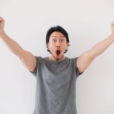 A surprised person reacting with an open-mouthed expression
