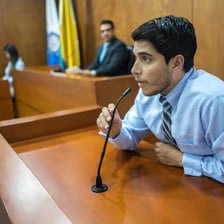 A witness giving testimony in a courtroom