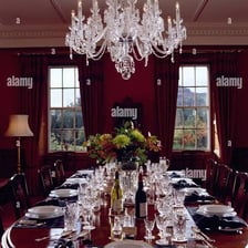 Ornate goblets arranged on a formal dining table.
