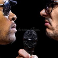 Two rappers facing off in a rap battle.