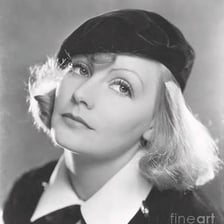 A female actor depicted wearing a beret.