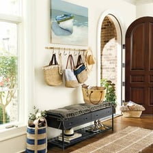 A home mudroom with storage for shoes, coats, and backpacks.
