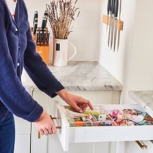 A person arranging objects with meticulous precision