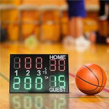 A sports scoreboard showing one team ahead by one point