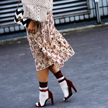 A pair of socks visibly worn with open-toed sandals