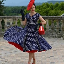 A person wearing clothing styled after an earlier fashion era
