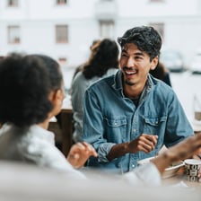 A person speaking to another person