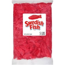 Red fish-shaped Swedish Fish gummy candies.