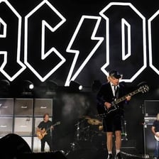 AC/DC performing onstage at a concert