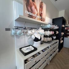 A lingerie-store fitting area used for measuring a bra size