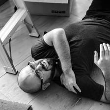 A person making a sympathetic or uncomfortable reaction after a minor injury