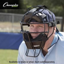 A baseball umpire wearing a protective facemask.