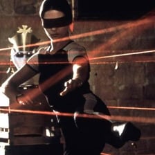 Red laser security beams crossing a room