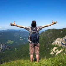 A person looking silently at a spectacular landscape