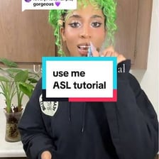 A person gesturing for someone else to ask a question