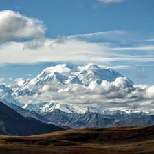 A landscape featuring prominent mountain peaks