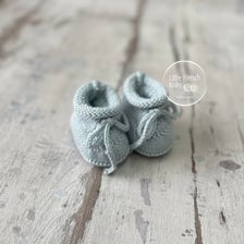 Small knitted booties made for a baby.