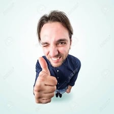 A person giving an approving thumbs-up gesture