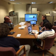 Editors working together in a magazine newsroom
