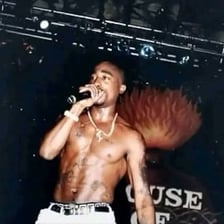 A photograph of rapper Tupac Shakur performing