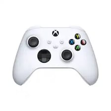 A Microsoft Xbox console beside its game controller