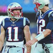 Teammates congratulating one another with pats on the back