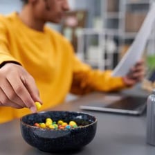 A person eating a snack in the afternoon