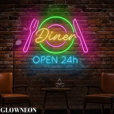 A glowing OPEN sign outside a diner at night.