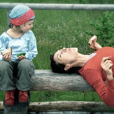A mischievous child displaying unruly behavior.