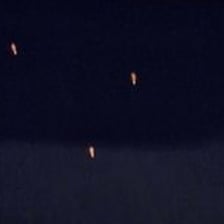 A mysterious unidentified object silhouetted against a night sky