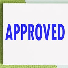 An approval mark showing OK