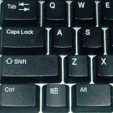 A computer keyboard with the Tab key clearly labeled