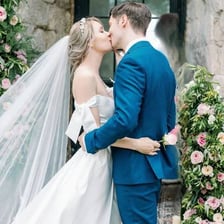 A newlywed couple kissing after exchanging wedding vows