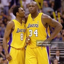 Shaquille O’Neal and Kobe Bryant in Los Angeles Lakers uniforms.