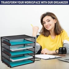 An office in-tray holding papers awaiting review.