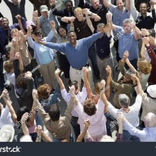 A person standing among a crowd of people.