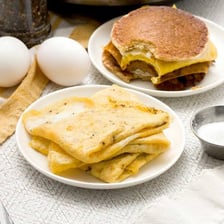 A folded omelet served on a breakfast plate