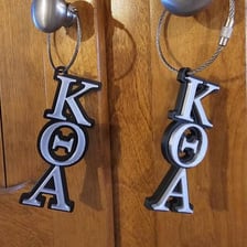 A Phi Beta Kappa key displaying Greek letters.