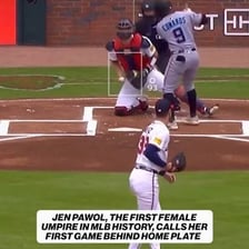 A baseball umpire signaling a strike behind home plate