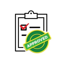 A manager approving a document with a check mark